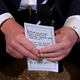 President Donald Trump holds his notes while hosting a listening session with student survivors of mass shootings, their parents and teachers in the State Dining Room at the White House in Washington, D.C., on Feb. 21, 2018. (Chip Somodevilla/Getty Images)